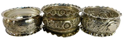 Lot 271 - Three early 20thC silver napkin rings, each of...