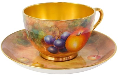 Lot 23 - A Royal Worcester porcelain teacup and saucer,...