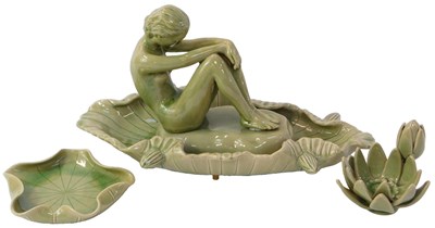 Lot 327 - A 20thC Thai celadon figure, modelled as a...
