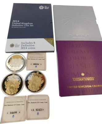 Lot 387 - Three Royal Mint coin sets, comprising a 2014...