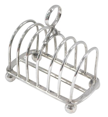 Lot 1312 - An Edwardian silver six division toast rack,...