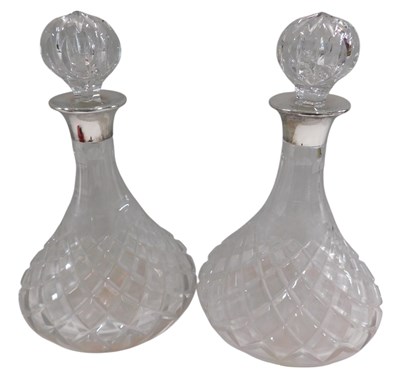 Lot 1332 - A pair of cut glass ship's style decanters and...