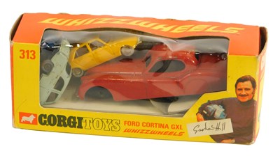 Lot 1411 - Three various playworn diecast vehicles, and a...