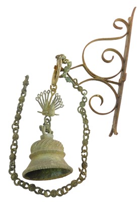 Lot 1438 - A bronze effect metal doorbell, with peacock...