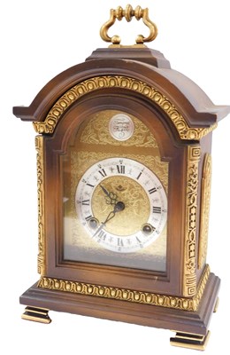 Lot 1479 - A mahogany and gilt mantel clock, the arched...
