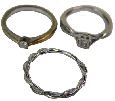 Lot 81 - A 9ct white gold solitaire ring, size I, a...