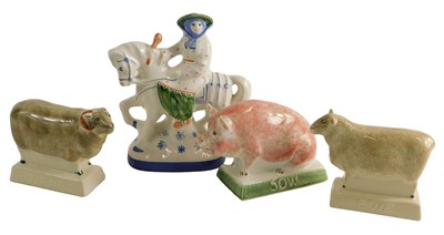 Lot 1495 - Three Rye pottery pigs, a ram, a ewe, and a...