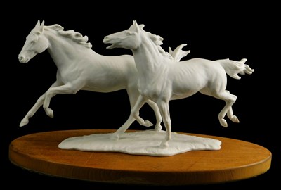 Lot 1506 - A Kaiser white porcelain group of two...