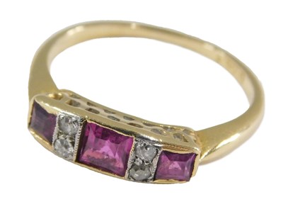 Lot 1017 - An Art Deco ruby three stone ring, set with...