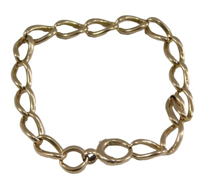Lot 1025 - A twisted oval link bracelet, on a bolt ring...