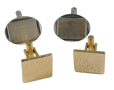Lot 1026 - A pair of silver oval cufflinks, with a...