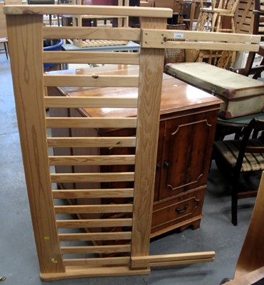 Lot 1528 - A pine double headboard, with a slatted back.