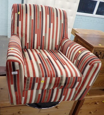 Lot 2547 - A swivel armchair, with striped fabric. 
The...