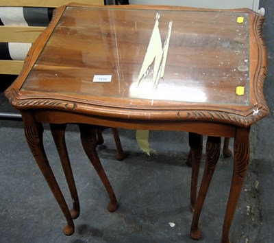 Lot 1532 - A yew nest of three tables, each inset with a...