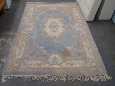 Lot 2565 - A Chinese cream ground wool rug, 271cm x 181cm.
