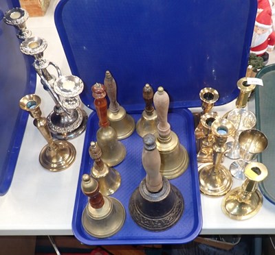 Lot 3141 - A group of brass and other handbells, with...