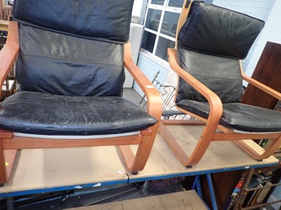 Lot 2573 - Two Ikea style armchairs, with black faux...