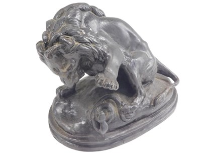 Lot 506 - 20thC School. Lion with serpent, bronze, on...