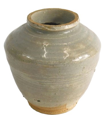 Lot 517 - A Chinese cream glazed pot, of coiled design,...