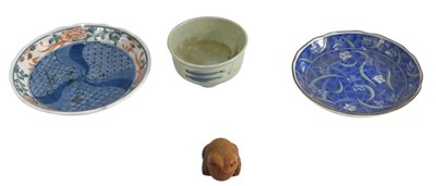 Lot 524 - A carved Japanese wooden netsuke, in the form...