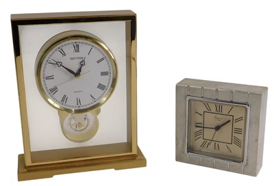 Lot 527 - A Rapport quartz table clock, in a brushed...