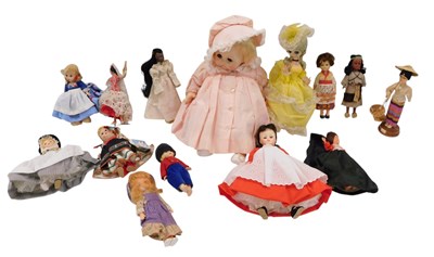 Lot 1474 - A large quantity of costume dolls, some boxed.