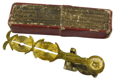 Lot 565 - A set of brass sovereign scales, the case...