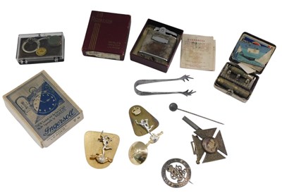 Lot 1054 - A Ronson pocket lighter, WWI wound badge,...