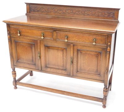 Lot 1527 - An early 20thC oak sideboard, with a raised...