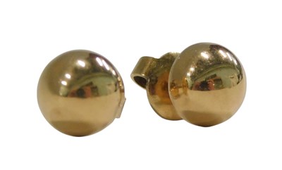 Lot 1063 - A pair of 18ct gold demi-ball earrings, with...