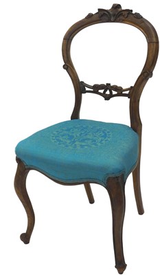 Lot 1534 - A Victorian walnut balloon back chair, with a...