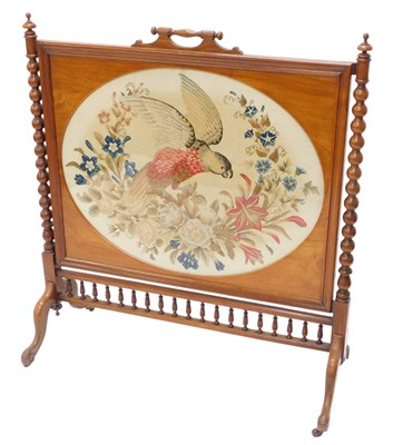 Lot 1572 - A Victorian walnut fire screen, inset with an...