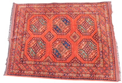 Lot 1584 - A Turkoman style rug, with a design of six...