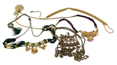 Lot 476 - A group of Asian paste set costume...