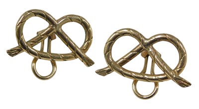 Lot 466 - A pair of knot clip earrings, stamped 10k, 9.2g.