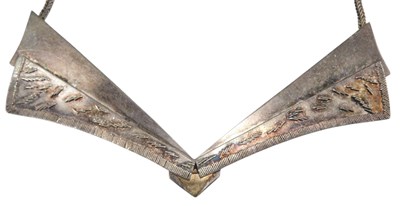 Lot 472 - A silver necklace, of layered V shaped form,...