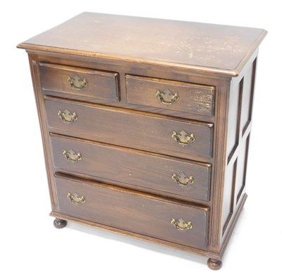 Lot 1559 - A Reprodux oak chest, of two short and three...