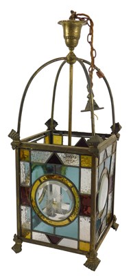 Lot 448 - A Victorian stained glass and brass framed...
