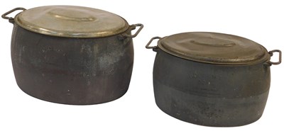 Lot 456 - Two Holcroft twin handled cast metal cooking...