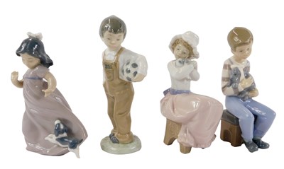Lot 470 - Four Lladro porcelain figures, modelled as a...
