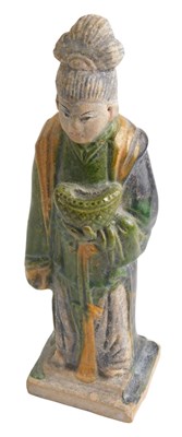 Lot 575 - A Chinese tomb type figure of an attendant, in...