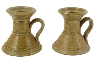 Lot 474 - A pair of A & J Young stoneware chambersticks,...