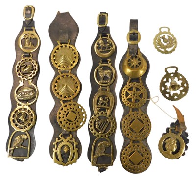 Lot 483 - A group of horse brasses and martingales,...