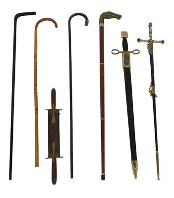 Lot 489 - A group of walking sticks, including one with...