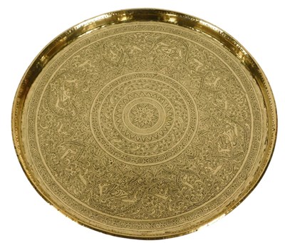 Lot 498 - An Indian brass charger, engraved with animals,...