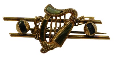 Lot 96 - A yellow metal bar brooch, set with jade,...