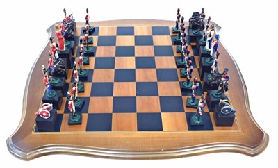 Lot 827 - A painted Battle of Waterloo chess set, each...
