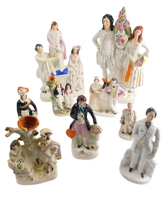 Lot 777 - A collection of Staffordshire figures, to...