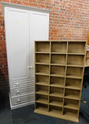 Lot 1023 - A white double wardrobe, with two doors over...