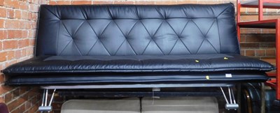 Lot 1027 - A contemporary black leather bench style futon...